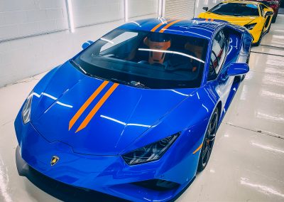 Blue Lamborghini Huracan with Orange Stripes
